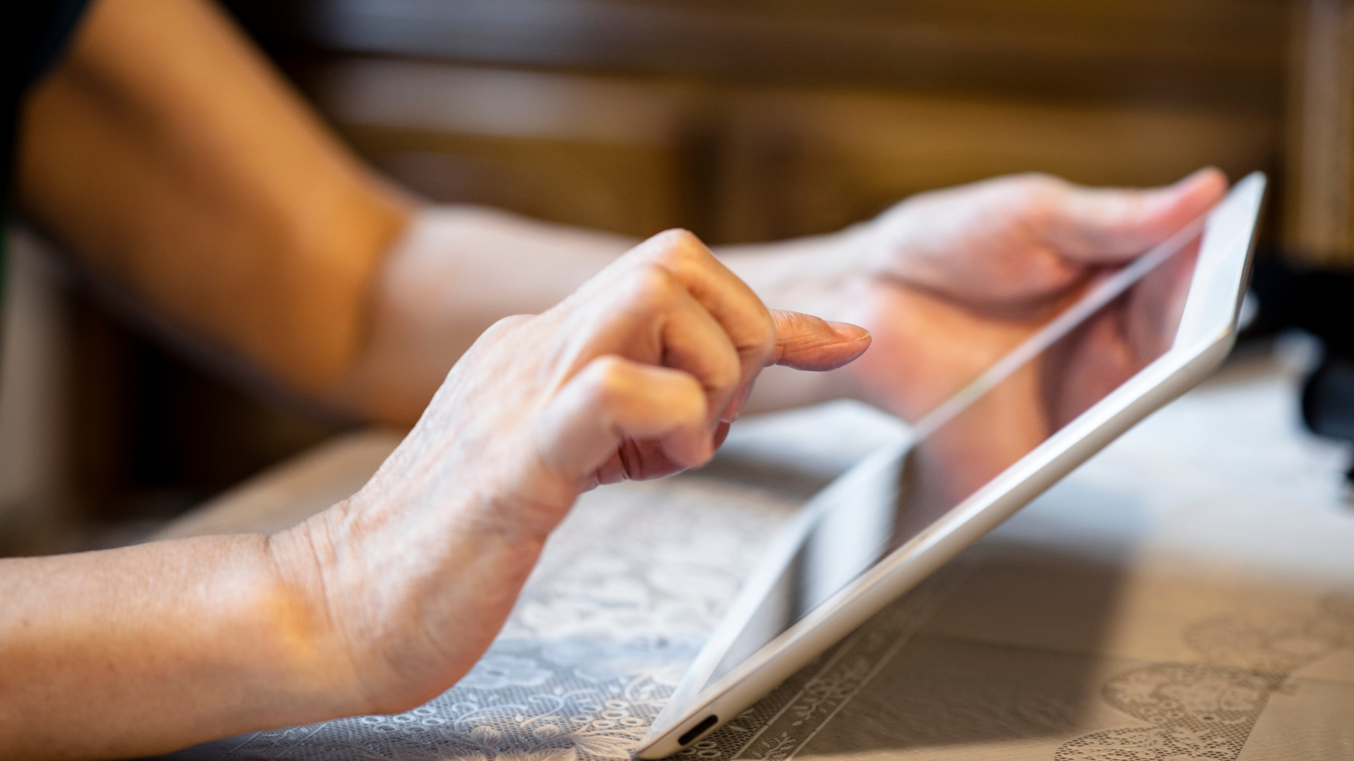 Senior using computer tablet